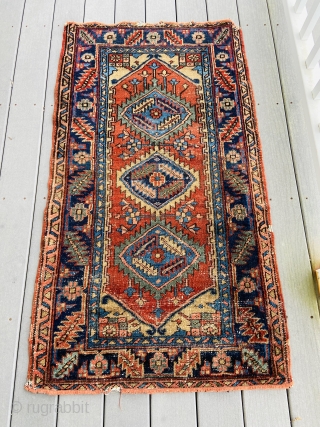 Heriz small rug - about 55” x 31”.  Overall scatter wear with machine surged ends.                 