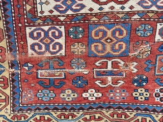 Kazak prayer rug - about 3’’6” x 4’10”. Great format, color and weave but not without wear, tear and crude repair (inc duct tape).         