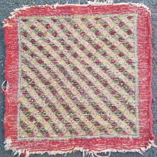 Persian Pushti- about 17" x 17". Interesting grid pattern with outer plain band. Wonderful color and mostly good pile.  Ends/side unravelling slightly.  $185/bo + ship      