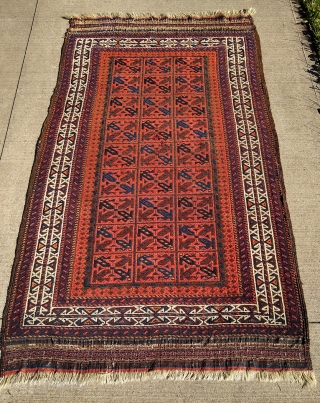 Beautiful Antique Baluch Rug, 39" X 68", complete with original goat-hair side selvages and flat weave ends. The rug appears to have all natural dyes. I counted 7-8 colors; deep indigo, medium  ...