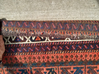 Beautiful Antique Baluch Rug, 39" X 68", complete with original goat-hair side selvages and flat weave ends. The rug appears to have all natural dyes. I counted 7-8 colors; deep indigo, medium  ...