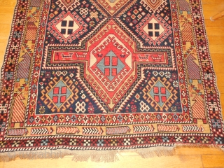 SHIRVAN WITH A DESIGN BURSTING WITH FOLK ART ELEMENTS.

SIZE OF 45 X 58 INCHES.

CHEMICAL RED DYE IN THE CENTER MEDALLION.

JUST WASHED.EXCELLENT PILE.

ONE OLD REPAIR ON THE EDGE AS SHOWN.    