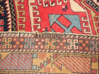 SHIRVAN WITH A DESIGN BURSTING WITH FOLK ART ELEMENTS.

SIZE OF 45 X 58 INCHES.

CHEMICAL RED DYE IN THE CENTER MEDALLION.

JUST WASHED.EXCELLENT PILE.

ONE OLD REPAIR ON THE EDGE AS SHOWN.    