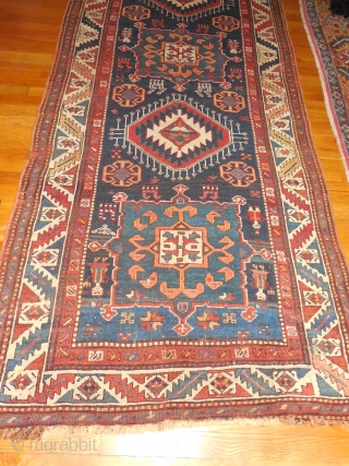 excellent pile - original as found condition

3 ft 10 inches x 10 feet 

kazak with 8 weavers shaking their  combs

$950 or BO          