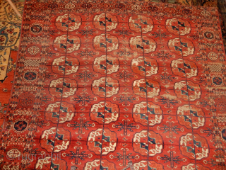TEKKE MAIN CARPET  SIZE OF ABOUT 7  X 8 1/2 FT 
LARGE ROUNDED GULS AND GOOD AGE VERY GOOD CONDITION WITH A BIT OF WEAR AT ONE END 
SOLID AND  ...