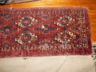 BOYLSTON ASSOCIATES ANTIQUE CAUCASIAN RUGS .COM 
TEKKE TORBA CIRCA 1870 DECENT PILE WITH SOME WEAR BUT WITH THE COMLETE BACK 
TWO HORNS ON EACH ANIMAL HEAD , NICE OLDEST INDIGO DYE USED  ...