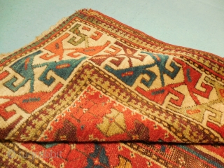 SHIRVAN/SOUTH CAUCASIAN/ MOGHAN  THAT HAS TAPE GLUED TO THE BACK

TO MAKE IT LIE FLAT ON THE FLOOR.

ABOUT 4 X 7 FT.

GOOD OLD NATURAL DYES.

BARGAIN-        