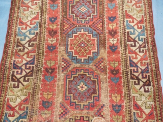 SHIRVAN/SOUTH CAUCASIAN/ MOGHAN  THAT HAS TAPE GLUED TO THE BACK

TO MAKE IT LIE FLAT ON THE FLOOR.

ABOUT 4 X 7 FT.

GOOD OLD NATURAL DYES.

BARGAIN-        