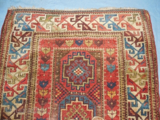 SHIRVAN/SOUTH CAUCASIAN/ MOGHAN  THAT HAS TAPE GLUED TO THE BACK

TO MAKE IT LIE FLAT ON THE FLOOR.

ABOUT 4 X 7 FT.

GOOD OLD NATURAL DYES.

BARGAIN-        