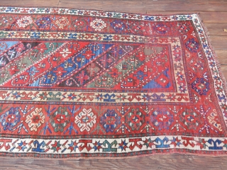 DECORATIVE KAZAK/GENJE CARPET WITH GOOD SIDES AND A BIT OF END LOSS - SIZE IS    4 FT X 9  1/2 FT -   PRICE - $700  