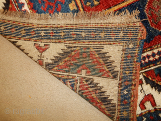 5 x 9 FOOT FACHRALO KAZAK IN GREAT ORIGINAL UNRESTORED CONDITION COMPLETE SIDES , ENDS 
NICE IVORY BORDER 
BOYLSTON ASSOCIAYES ANTIQUE CAUCASIAN RUGS .COM


         