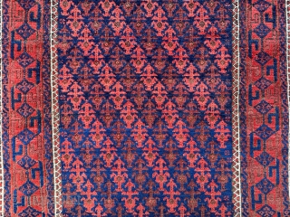 Lovely small antique Baluch rug with small overall shrub pattern on a glowing indigo-blue ground. In excellent pile condition 1.52m x 0.92m (5' x 3').        