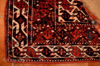 A quarter panel of a 19th century knotted-pile Yomud Turkmen Bokche in very good condition with the remains of its original plain-weave back. The colours are all vegetable.     