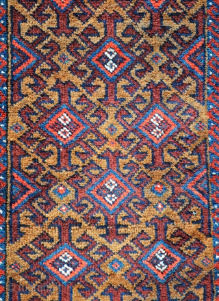 Baluch balisht in excellent condition, complete with plain-weave back - 89 x 43cm (2' 11" x 1' 5").               