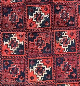 Baluch rug with overall design of Turkmen 'ayna' guls in full pile with complete plain-weave skirts - 2.44m x 1.17m (8' 0" x 3' 10").        