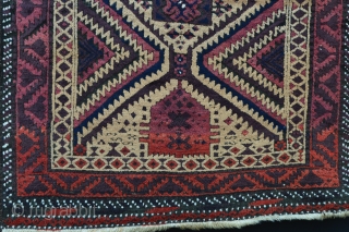 Mushwanni Baluch in excellent overall condition with soft, silky wool, a beautiful old aubergine and incorporating natural camel-hair in the field - 1.65m x 0.87m (5' 5" x 2' 10").   