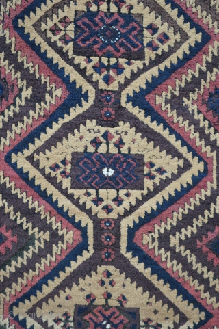 Mushwanni Baluch in excellent overall condition with soft, silky wool, a beautiful old aubergine and incorporating natural camel-hair in the field - 1.65m x 0.87m (5' 5" x 2' 10").   