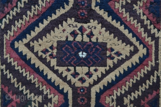 Mushwanni Baluch in excellent overall condition with soft, silky wool, a beautiful old aubergine and incorporating natural camel-hair in the field - 1.65m x 0.87m (5' 5" x 2' 10").   