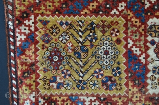 Rare, compartmentalised, small knotted-pile mid 19th century Qashqa'i rug in poor condition with various old reweaves but incredibly beautiful and collectable. Age is difficult to determine but this rug has a very  ...