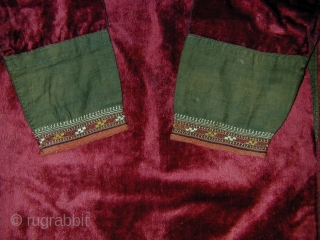 Tekke Turkmen Widow's Velvet Chyrpy. Early 20th c. Back amulet and embroidered cuffs. Very good condition. Its relatively small size makes it easy to display.        