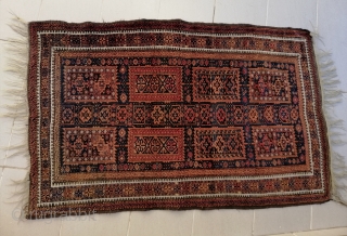 A fine antique truly tribal Timuri Baluch rug with an unusual central axis of small mihrab-like motifs, early 20th c. Well preserved and for a nice price.      