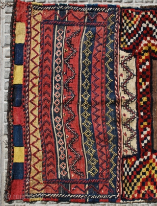 A very tribal Bakhtiari khorjin (double bag), prob. early 20th c. 90 x 240 cm. Unsewn sides. In good condition. Slight stains to one back. Very attractive pile parts and "fireplace" back  ...