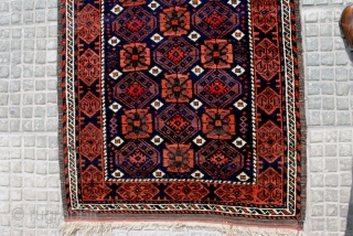 Very attractive Small Baluch rug with a clean Mina Khani design. Early 20th c. 85 x 143 cm. Shiny high pile and a beautifull blue-black indigo ground  . Secured end kilims.  ...