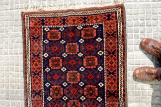 Very attractive Small Baluch rug with a clean Mina Khani design. Early 20th c. 85 x 143 cm. Shiny high pile and a beautifull blue-black indigo ground  . Secured end kilims.  ...