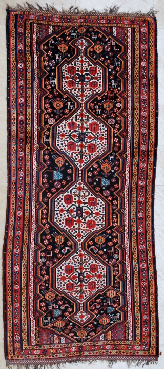 Luri rug, late 19th c. 145 x 338 cm. Brilliant saturated and contrasting colors and very pleasent design. Low pile to lower end but not dramatic. Nice checkered polychrome end kilims. Good  ...