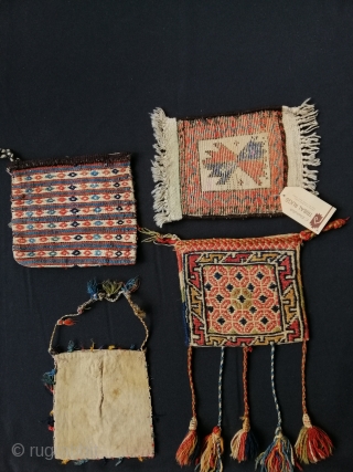 Three tribal vanity bags (Kurdish, Qashqāï and Shāhsavan) and one Baluch mini rug.                    