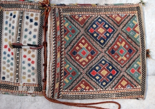NW Persian complete saddlebag, early 20th c. 42 x 111 cm. Wool extra weft brocade on cotton. Nice natural colours, but some fuchsine and a few bright red highlights. Fine weave, Excellent  ...