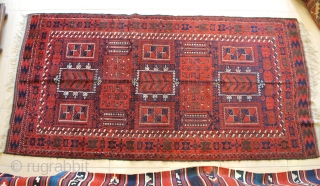 Baluch rug, East Persia, ca. 1900. 117 x 225 cm. Warm saturated red. High pile except for the corroded black, Some repiled black. Very good condition in general.     