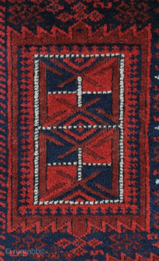 Baluch rug, East Persia, ca. 1900. 117 x 225 cm. Warm saturated red. High pile except for the corroded black, Some repiled black. Very good condition in general.     