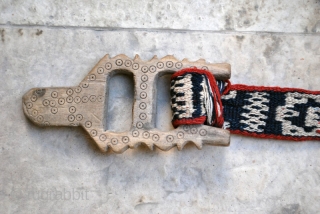 Bakhtiari pack band with carved wodden lock and a rich variety of archaic and characteristic motifs. 5 x 830 cm. (2" x 27'8"). Well preserved in general with very few slightly damaged  ...