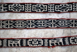 Bakhtiari pack band with carved wodden lock and a rich variety of archaic and characteristic motifs. 5 x 830 cm. (2" x 27'8"). Well preserved in general with very few slightly damaged  ...