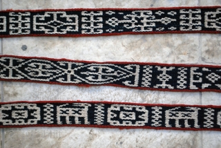 Bakhtiari pack band with carved wodden lock and a rich variety of archaic and characteristic motifs. 5 x 830 cm. (2" x 27'8"). Well preserved in general with very few slightly damaged  ...