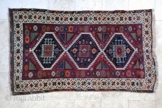 East Anatolian, early 20th c. 123 x 210 (4"1' x 7'). Uneven corrosion of ground color. Small repiled areas, small reweave at upper end (braid), secured at lower. Original selvages.   