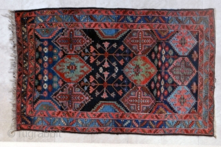 Bakhtiari rug from the village of Harchegan. 140 x 216 cm. Circa 1920-30. All natural colours. Wool weft. Spot of lpw pile. Original upper end, secured lower end.     