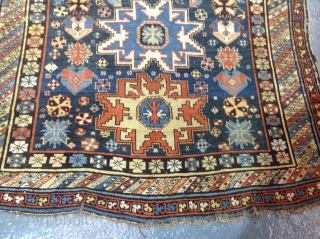 Antique lesghi star design shirvan carpet, 253x166cm, country house find, showing some dye erosion and repairs.                 