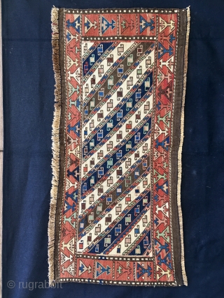 Shahsavan Moghan Sumack mafrash side/long panel. 
Size is cm 45x100 ca. Datable 1880/1890. The Shahsavan loved to use the moharamat/stripes pattern, in different variations. Here, in this panel we have diagonal moharamat  ...