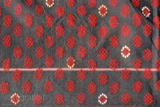 With description:
Textiles of Burma. This is a woman's wrap around skirt of the Southern Jingpho tribal group. Cm 147x85. This group, also called Chingpaw, lives mainly in Northern Burma, Kachin state and  ...