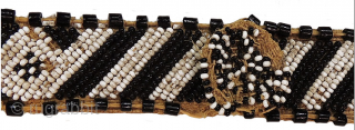 AFRICA!
Kuba people beaded headband - Congo. Mid 20th century or earlier. Cm 73x3 ca. Raffia, cowry shells, beads. Such headbands were worn by nobles of Kuba royal families. They were the sign  ...