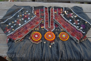Nuristan. Jumlo or woman wedding dress from Kohistan/Nuristan, Northern Pakistan and Afghanistan. Heavily silk embroidered on black cotton, with lots of white and copper plastic buttons, metal roundels, lead beads, etc. Early  ...