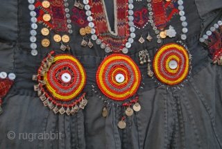 Nuristan. Jumlo or woman wedding dress from Kohistan/Nuristan, Northern Pakistan and Afghanistan. Heavily silk embroidered on black cotton, with lots of white and copper plastic buttons, metal roundels, lead beads, etc. Early  ...