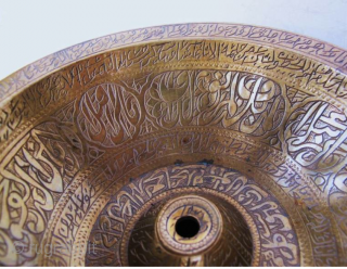 "Islamic magic cup"
"RARE ANTIQUE MUSEUM QUALITY BRASS CHIL - KHALID (RITUAL VESSEL) FROM BUKHARA AREA UZBEKHISTAN. THE VESSEL IS COMPLETELY ENGRAVED WITH BEAUTIFUL KUFIC CALLIGRAPHY FROM THE HOLY QURAN." 
This was the  ...