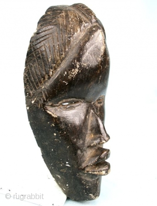 Stone carved Dan/Ivory Coast-Liberia  mask. Second half 20t c. Cm 20x12x6,5. Weight 1kg/2pounds ca. Great carving quality.  Seems a "runners mask", while masks like this one are sacred and not  ...