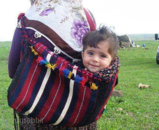 Parzun or baby/all purpose carrier. 
Eastern Anatolia, Van, Hakkari, Siirt..... 
Cm 50x55 closed/bent. Early 20th c. 
Mother used to weave a parzun, a baby carrier adding all kind of amulets, dileks(wishes), coins,  ...