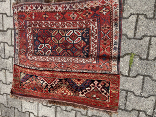 Watch the Dragons in the cage!

Lori/Bakhtiari imho, but could be Qashqai as well.......or?
Sumack & pile weaving
Size is cm 88x102
Interesting pattern with dragons in the central field, or?
Is it common?
Anyway, a great bag,  ...
