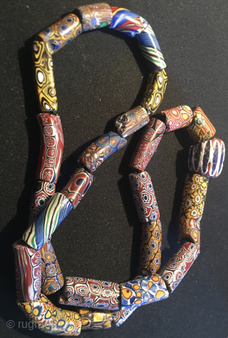 28 Murrine beads. 
19th-century Venetian Murrine's beads.
"Murrine" beads.
They are antique, datable 1860/1920 and were blown in Venice on the island of Murano.
They were shipped to Western Africa where they were used as  ...