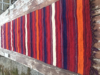 Colorful kilim striped runner/strip. Cm 67x256. 90 to 100 years of age. Could be Mazandaran?. Very fine weave. Great colors. Red, orange, blue and white. Warps are dyed in aubergine!! Very unusual.  ...